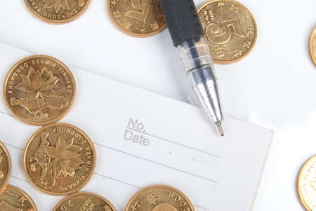 Coins and penの写真素材