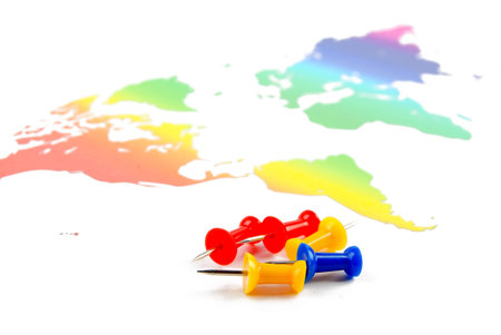 Push pin and world map
