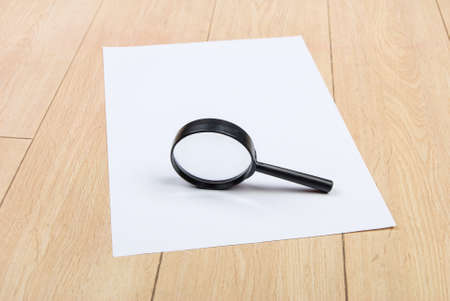 A4 paper and magnifierの写真素材