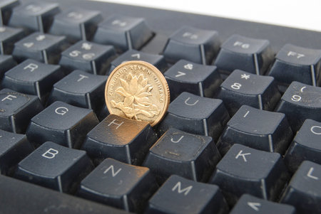 Computer keyboard and coin