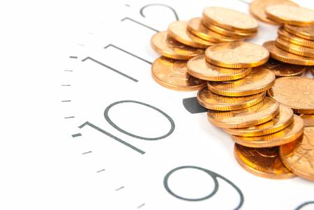 Clock and coinsの写真素材