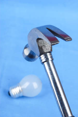 Hammer and light bulbの写真素材