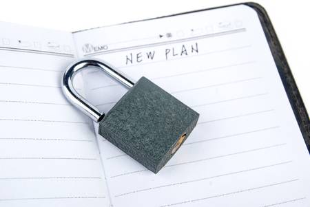 Padlock and notepadの写真素材