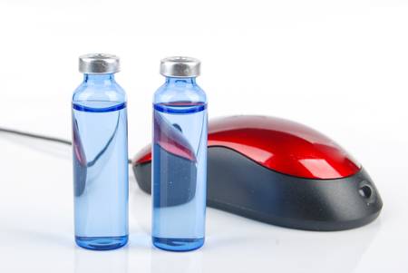 Vial and computer mouseの写真素材
