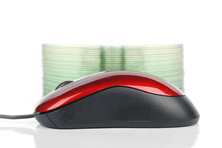 DVD and red computer mouseの写真素材
