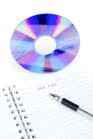 DVD and notepad with penの写真素材