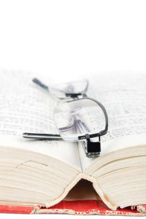 Eyeglasses and dictionaryの写真素材
