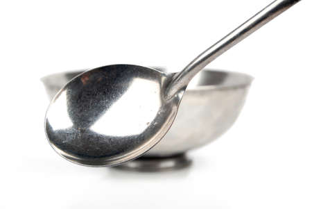 Silver bowl and spoonの写真素材