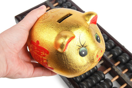 Piggy bank and chinese abacusの写真素材