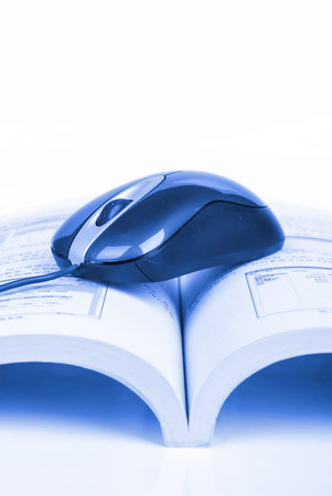 Computer mouse and book