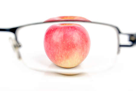 Red apple and eyeglassesの写真素材