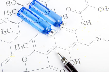 Pen and medicine on chemical formula
