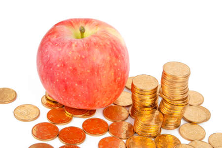 Red apple and coinsの写真素材