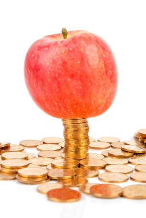 Red apple and coinsの写真素材