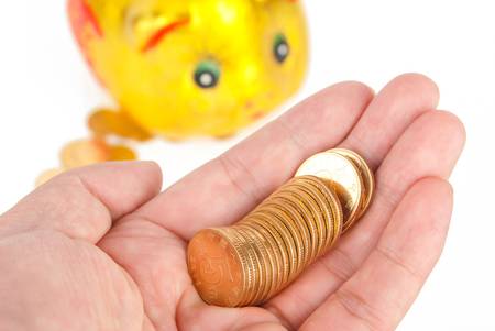 Piggy bank with coinsの写真素材