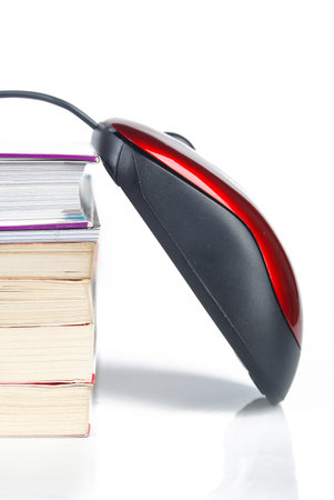 Mouse and books on white background