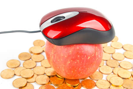 Apple and mouse with coins on white backgroundの写真素材