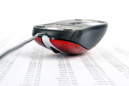 Computer mouse on stock market dataの写真素材