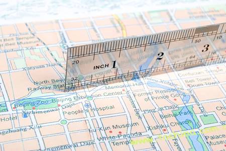 Metal ruler on mapの写真素材