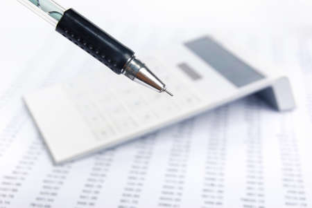 Financial statement with calculator and penの写真素材