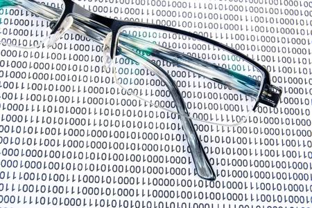 Eyeglasses on binary codeの写真素材
