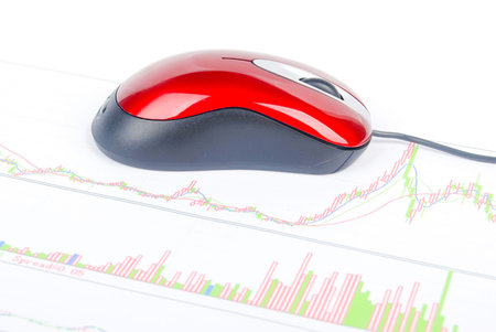 Computer mouse on stock graph