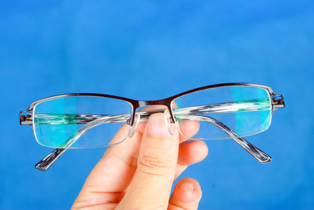 Glasses in handの写真素材