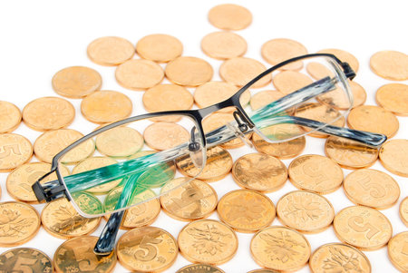 Eyeglasses with coinの写真素材