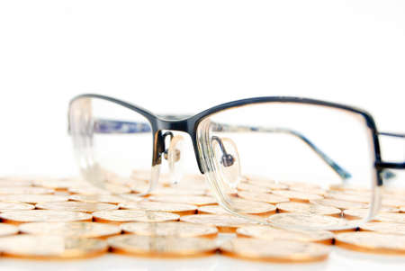 Eyeglasses with coinの写真素材