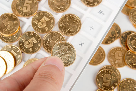 Coin and calculatorの写真素材