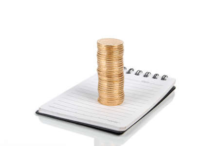 Coin and notebookの写真素材