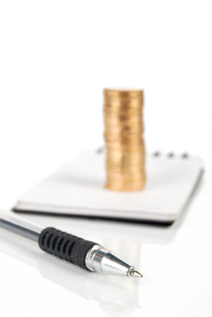 Coin and notebookの写真素材