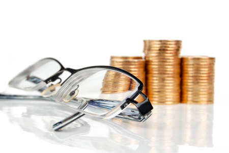 Coin and glassesの写真素材