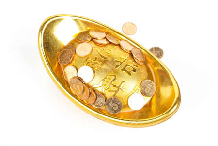 Gold ingot with coinの写真素材