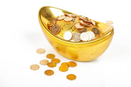 Gold ingot with coinの写真素材