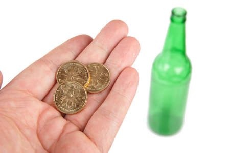 Beer bottle and coinの写真素材