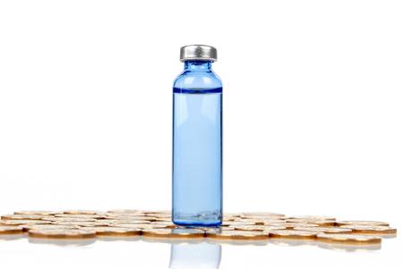 Vial and coinの写真素材
