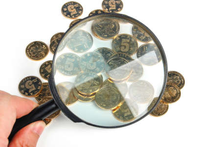 Magnifier and golden coinの写真素材