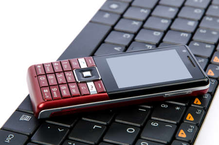Mobile phone and computer keyboardの写真素材
