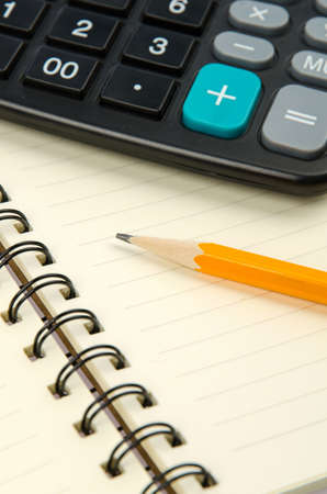 Pencil and notepad with calculatorの写真素材