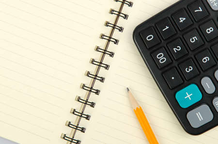 Pencil and notepad with calculatorの写真素材