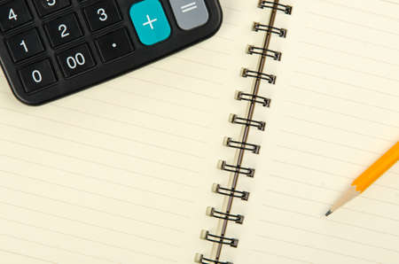 Pencil and notepad with calculatorの写真素材