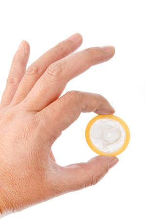 Hand with condom isolated on whiteの写真素材
