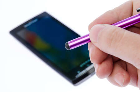Capacitive pen and smartphone on white backgroundの写真素材