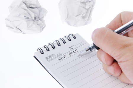 Crumpled paper ball and notepadの写真素材