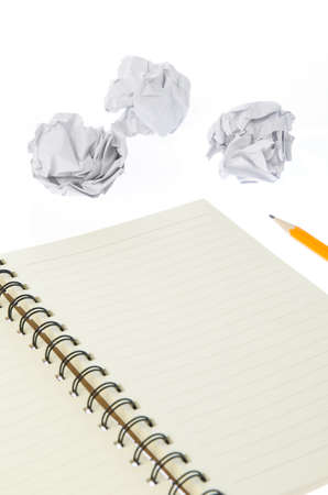 Crumpled paper ball and notepadの写真素材