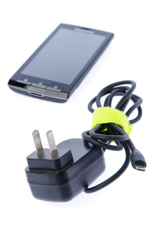 Mobile phone and chargerの写真素材