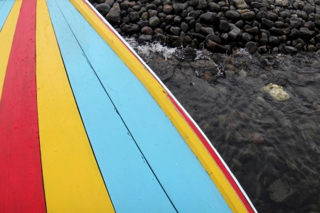 a taxi boat textured background with water and stoneの写真素材