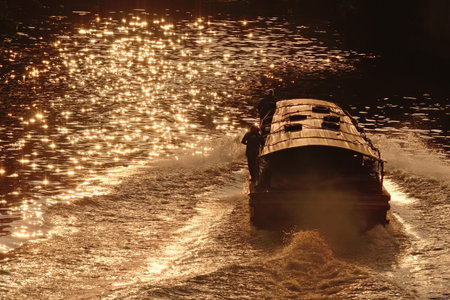 a  passenger ship long tail boat from bangkok thailandwith sun light