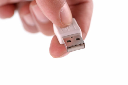 white usb on hand on white blackground